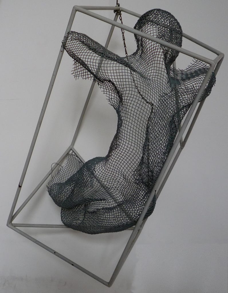 Metal object 60*30*30 cm. A human figure escaping the box.